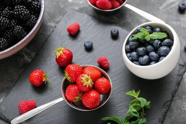 stock image Composition with different fresh berries on grey background, closeup