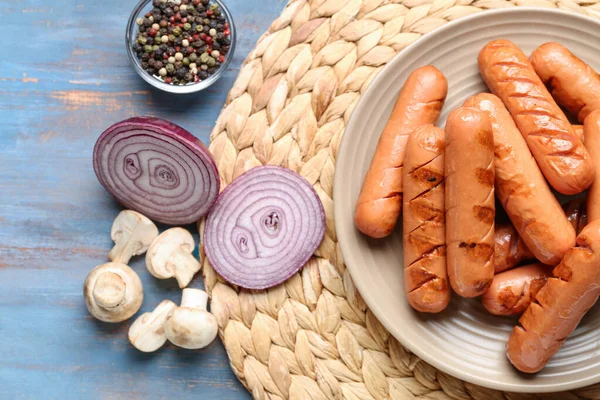 Plate Tasty Sausages Onions Mushrooms Blue Wooden Table — Stock Photo, Image
