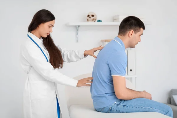 Female Doctor Checking Posture Young Man Clinic — Stock Photo, Image