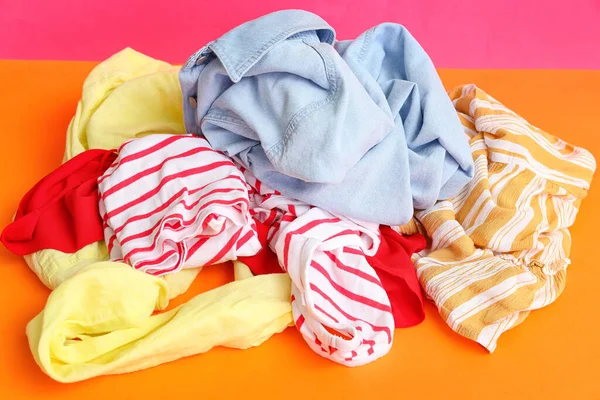 Pile Dirty Laundry Orange Table Pink Background — Stock Photo, Image