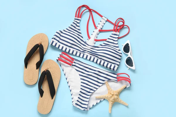 Stylish Swimsuit Sunglasses Flip Flops Starfish Color Background — Stock Photo, Image