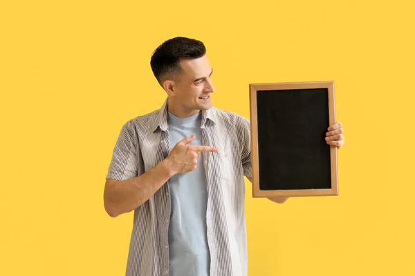 Male Teacher Pointing Chalkboard Yellow Background — Stock Photo, Image