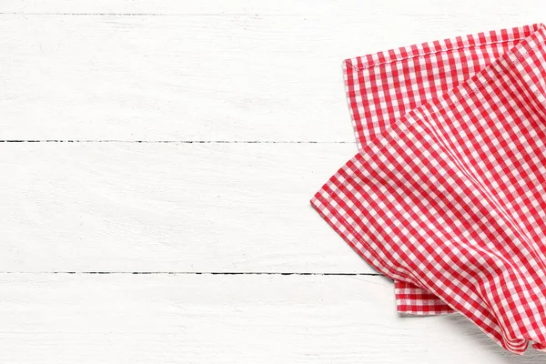 stock image Red checkered napkin on light wooden background