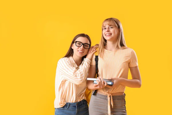 Female Students Yellow Background — Stock Photo, Image