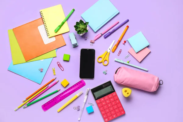 Different Stationery Calculator Mobile Phone Lilac Background — Stock Photo, Image