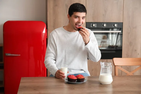 Young Man Glass Milk Eating Muffin Kitchen — Stock Photo, Image