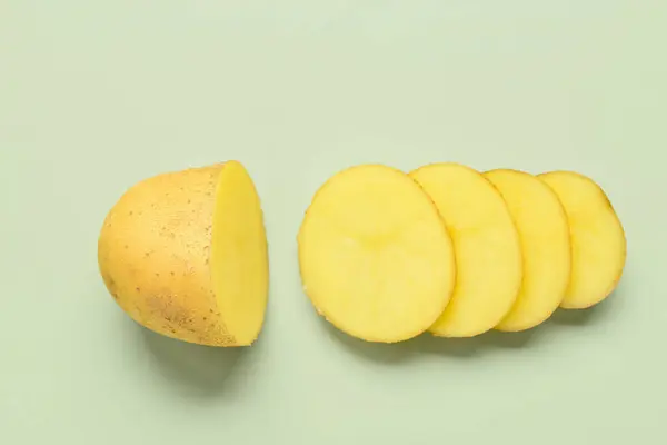 Raw Cut Potato Green Background — Stock Photo, Image