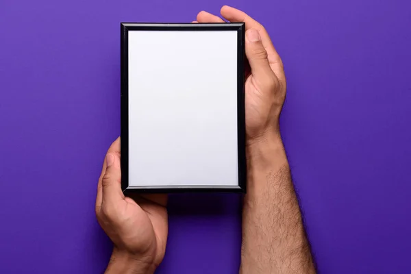 Man Holding Blank Photo Frame Purple Background — Stock Photo, Image