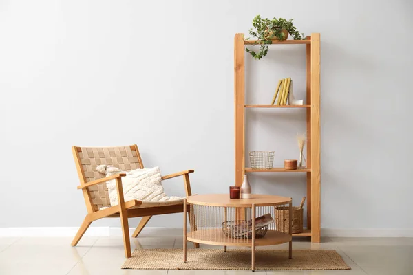 Wicker Armchair Wooden Coffee Table Shelving Unit Grey Wall — Stock Photo, Image