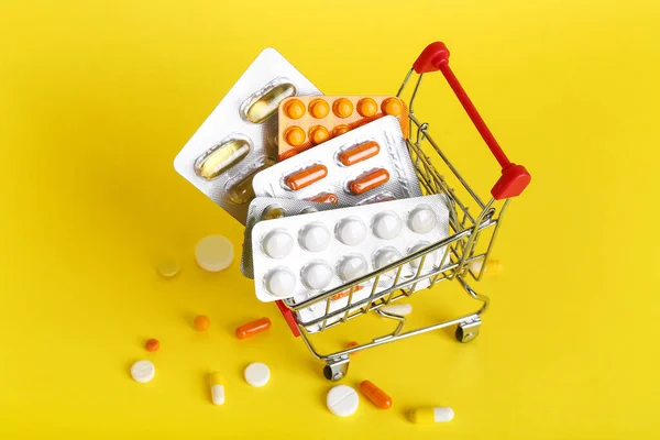 Mini Shopping Cart Different Medicines Yellow Background — Stock Photo, Image