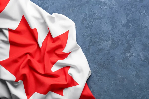 stock image Flag of Canada on blue background