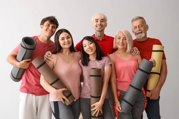 Group Sporty People Fitness Mats Light Background — Stock Photo, Image