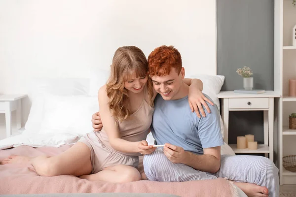 Happy Young Couple Pregnancy Test Bedroom — Stock Photo, Image