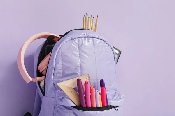 School Backpack Different Stationery Headphones Purple Background — Stock Photo, Image