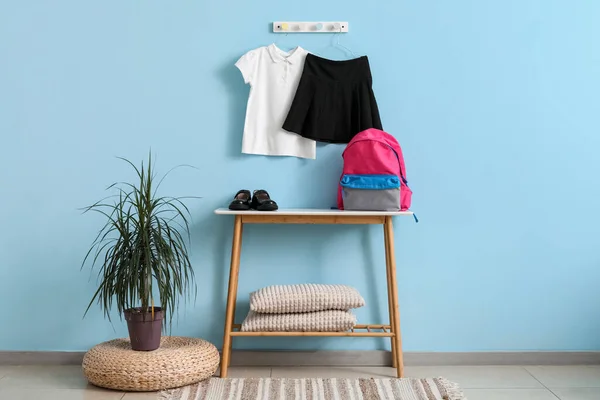Table Backpack Shoes Stylish School Uniform Hanging Blue Wall Room — Stock Photo, Image