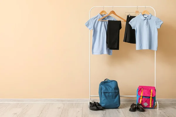 Rack Stylish School Uniform Backpacks Shoes Color Wall — Stock Photo, Image