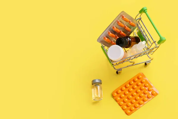 Mini Shopping Cart Different Medicines Yellow Background — Stock Photo, Image