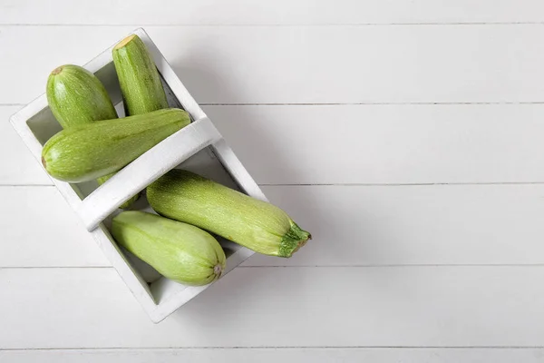 Basket Fresh Green Zucchini White Wooden Background — Stock Photo, Image