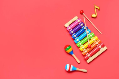 Different musical instruments on color background