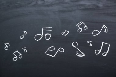 Siyah arkaplanda farklı müzik notaları