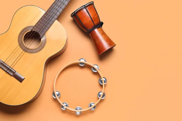 stock image Different musical instruments on color background