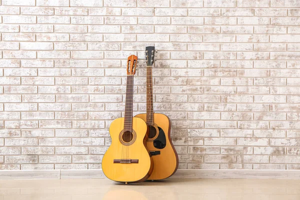 Two Guitars Brick Wall — Stock Photo, Image