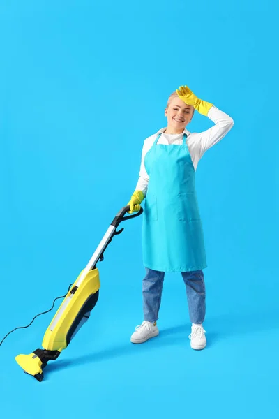 Tired Young Woman Vacuum Cleaner Blue Background — Stock Photo, Image