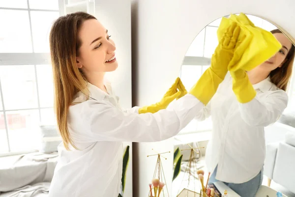 Young Woman Cleaning Mirror Home — Stock Photo, Image