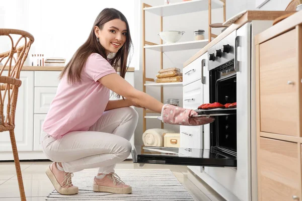 Young Woman Taking Tray Muffins Electric Oven Kitchen — Stock Photo, Image