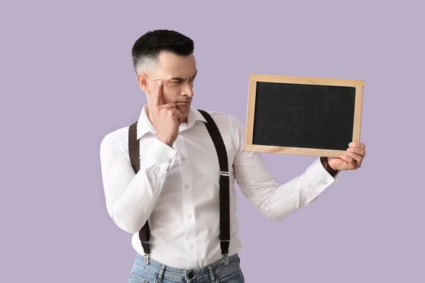 Thoughtful Male Teacher Chalkboard Lilac Background — Stock Photo, Image