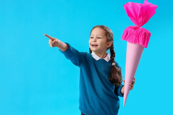 Happy Little Girl Pink School Cone Pointing Something Blue Background — Stock Photo, Image