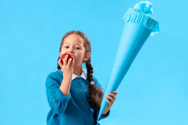Happy Little Girl School Cone Eating Fresh Apple Blue Background — Stock Photo, Image