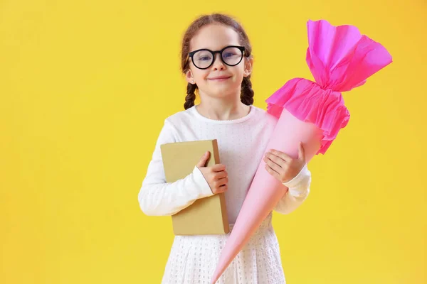 Happy Little Girl Eyeglasses Pink School Cone Book Yellow Background — Stock Photo, Image