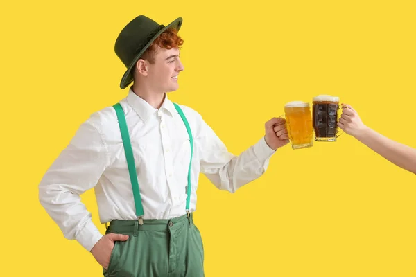 Young Man Traditional German Clothes Female Hand Beer Yellow Background — Stock Photo, Image