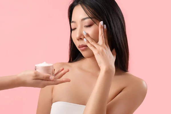Beautiful Asian Woman Hand Cream Pink Background — Stock Photo, Image