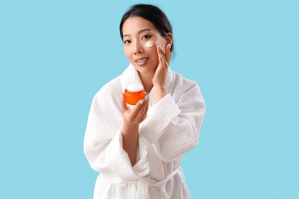 Beautiful Asian Woman Facial Cream Blue Background — Stock Photo, Image
