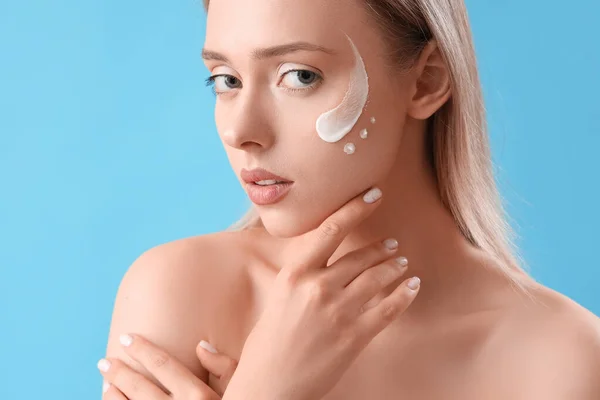 Pretty Young Woman Cream Her Face Blue Background — Stock Photo, Image