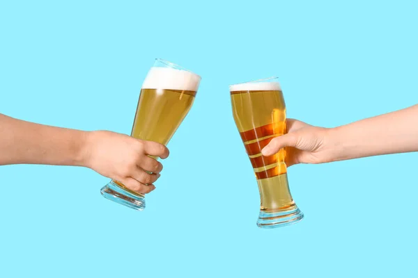 Female Hands Glasses Cold Beer Clinking Blue Background — Stock Photo, Image