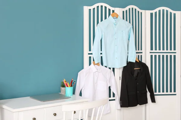 Stylish School Uniform Hanging Folding Screen Room — Stock Photo, Image