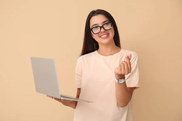 Happy Young Female Programmer Laptop Showing Heart Gesture Beige Background — Stock Photo, Image
