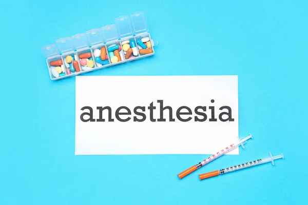 Paper Word Anesthesia Pills Syringes Blue Background — Stock Photo, Image