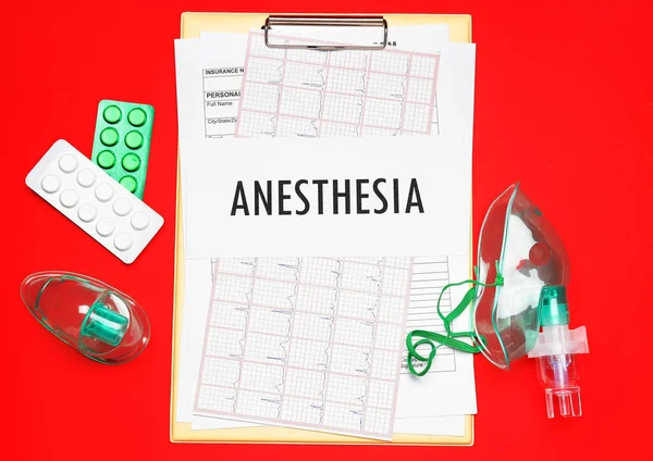 Clipboard Word Anesthesia Pills Oxygen Masks Red Background — Stock Photo, Image