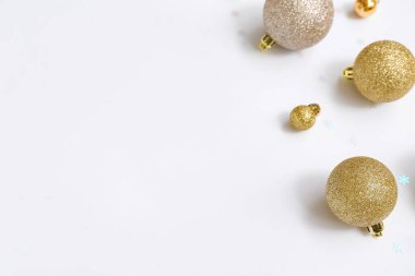 Different Christmas balls and snowflakes on white background