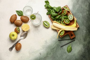 Ingredients for preparing kiwi smoothie on grunge background