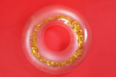 Inflatable ring on red background