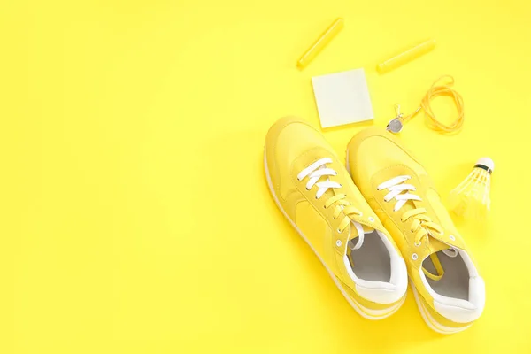 Sneakers Whistle Shuttlecock Stationery Yellow Background — Stock Photo, Image