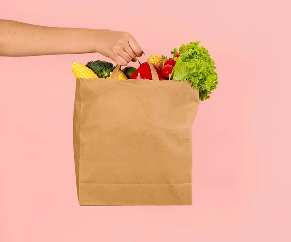 Female Hand Paper Bag Full Fresh Vegetables Pink Background — Stock Photo, Image