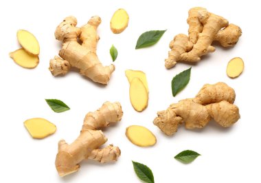 Fresh ginger roots and leaves on white background