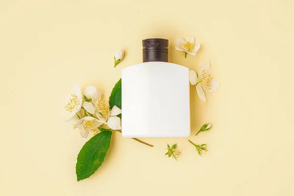 Bottle Cosmetic Product Beautiful Jasmine Flowers Color Background — Stock Photo, Image
