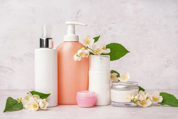Set Cosmetic Products Beautiful Jasmine Flowers Light Background — Stock Photo, Image